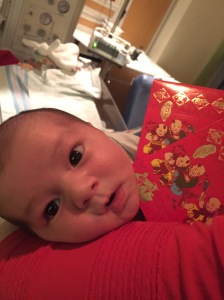 Verity, on her first Chinese New Year receiving her first lucky red envelope.